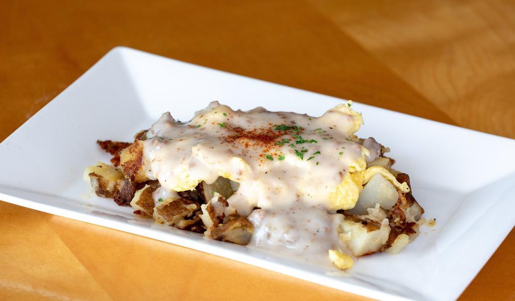 Country Skillet · Our home fried potatoes, topped with two eggs any style, topped with sausage gravy and toast.