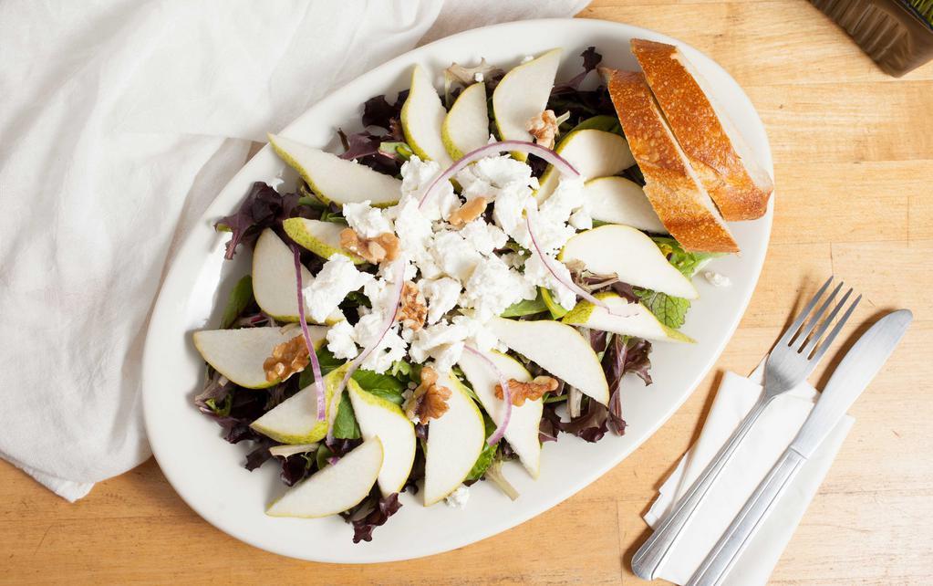 Pear and Goat Cheese Salad · With mixed greens, sliced pears, roasted walnuts, onions and goat cheese tossed in honey dijon vinaigrette. Served with bread.