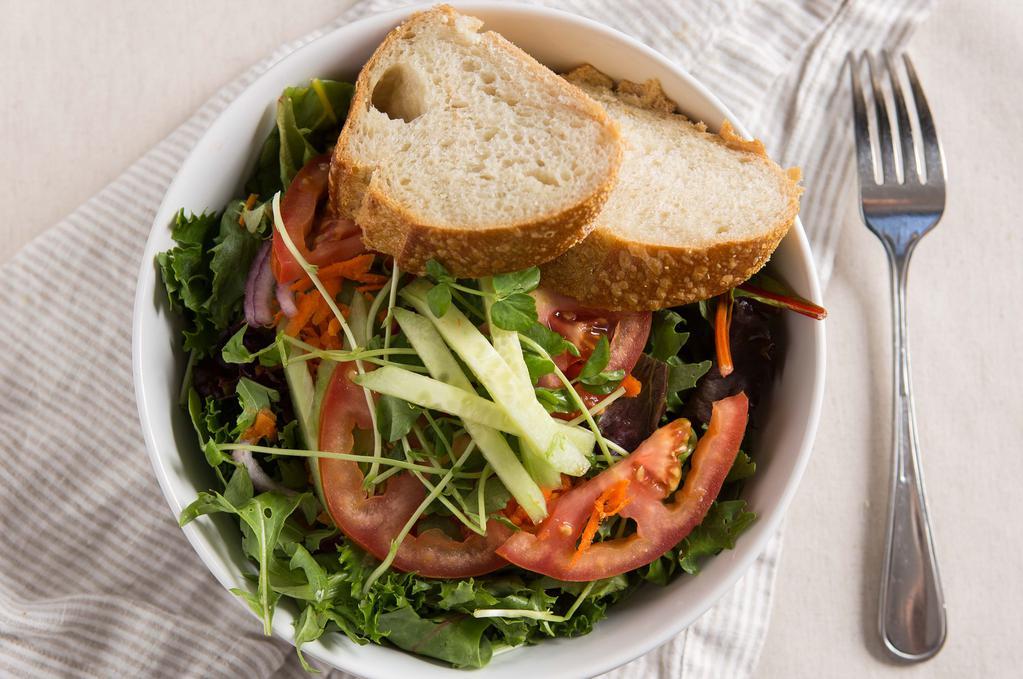 House Salad · Mixed greens, avocado, pea sprouts, carrots, cucumbers, onions and tomato tossed in balsamic vinaigrette. Served with bread.