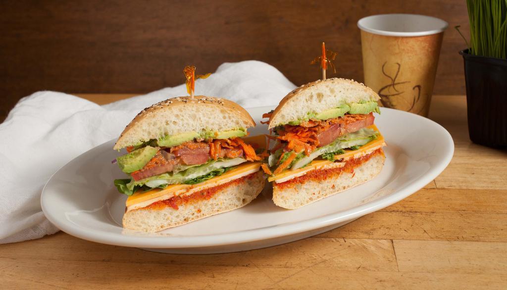 Sun-Dried Tomato Pesto Sandwich · Avocado, smoked gouda, cheddar, carrots, cucumber, tomato, onions and pea-sprouts with balsamic vinaigrette and served on a French roll.
