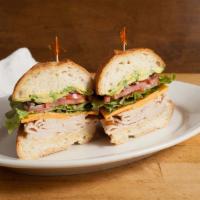 Smoked Turkey Sandwich · Avocado and cheddar with lettuce, tomato and red onions, mayo and dijon and served on a sour...