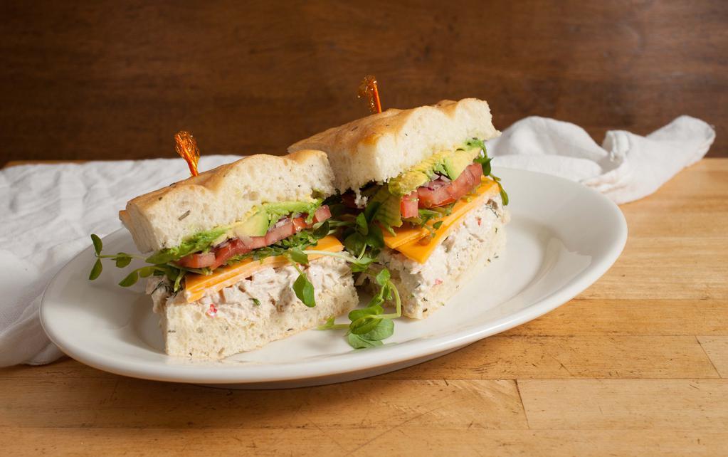 Fresh-Herbed Albacore Tuna Sandwich · With cheddar, avocado, tomato, red onions, pea sprouts, mayo and dijon and served on focaccia.