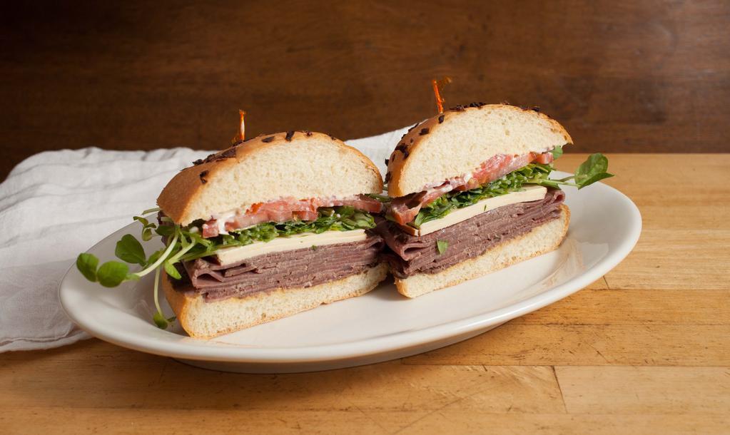 Roast Beef Sandwich · Horseradish, sweet and hot mustard, smoked gouda, red onion, tomato, pea sprouts, mayo and served on an French roll.