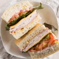 The Fillmore Sandwich · Ham, roasted turkey, cheddar, provolone, lettuce, tomato, onion and pepperoncini, mayo, dijo...