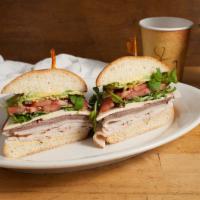 Turkey Love Sandwich · Roasted turkey, tomato, red onions, carrots, cucumbers, lettuce, pea sprouts, mayo and dijon...