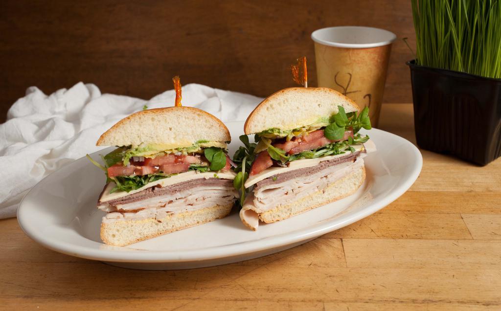 Turkey Love Sandwich · Roasted turkey, tomato, red onions, carrots, cucumbers, lettuce, pea sprouts, mayo and dijon on wheat bread.