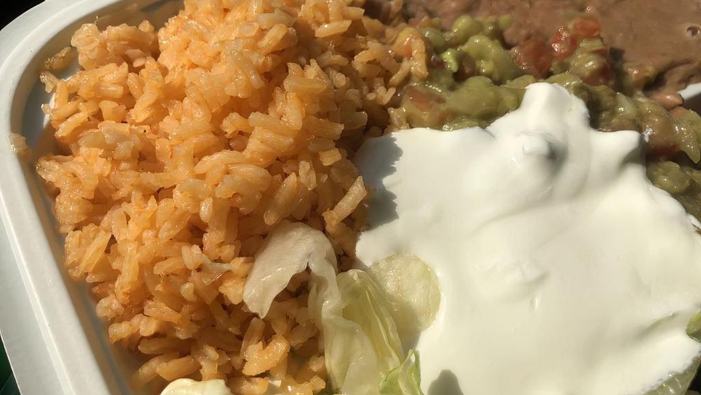 Enchiladas Platillo (3 Pcs) · With rice, beans, lettuce, tomatoes, guacamole, sour cream and tortillas.