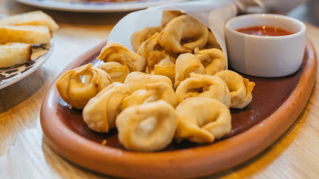 The Fried Vegan Momo · Fried. Nepali signature dumpling, served with chef's achaar dipping sauce.