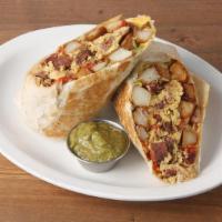 Manny's Breakfast Burrito * · your choice of pastrami or mushrooms, eggs, caramelized onions, roasted peppers, potatoes, m...