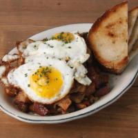 Corned Beef Hash * · pieces of corned beef, caramelized onions, roasted peppers, & crispy potatoes topped with su...