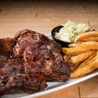 Baby Back Ribs · served with choice of three sides