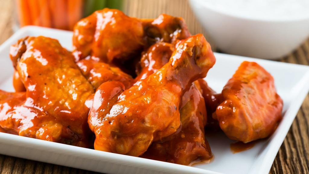The Buffalo Wings · Crispy chicken wings fried and tossed in buffalo sauce.