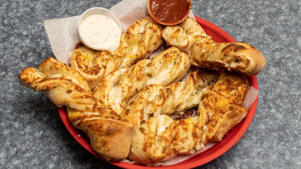 Garlic Parmesan Twists (6 Pieces) · Our famous Garlic Parmesan Twists. Rolled fresh daily and baked to perfection with fresh garlic, our three cheese blend and Parmesan cheese. Served with your choice of dipping sauce.
