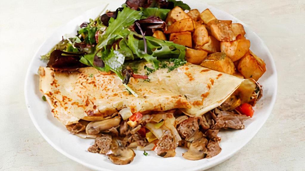 Philly Cheese Steak Crepe · Grilled Angus Beef, American Cheese, Mushrooms, Onions & Bell Peppers  with Chipotle Aioli

Served with House Potatoes & House Salad
