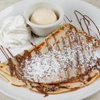 Nutella Crepe · Nutella
Topped with Powdered Sugar and Served with Vanilla Bean Ice Cream on the Side