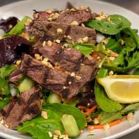 Thai Steak Salad · New York Strip Steak, Mixed Greens, Tomatoes, Cucumbers, Carrots, Red Onions, Peanuts, Mixed...