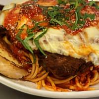 Chicken Parmigiana · Breaded Chicken Breast with Melted Mozzarella Served Over Spaghettini with Marinara Sauce