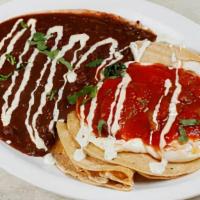 Huevos Rancheros · Two Eggs Over Easy, Pepper Jack Cheese & Corn Tortillas, Topped With Our Spicy Ranchero Sauc...