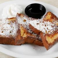 Brioche French Toast · Three Thick Sliced Brioche French Toast Served With 100% Maple Syrup, Powdered Sugar and Whi...