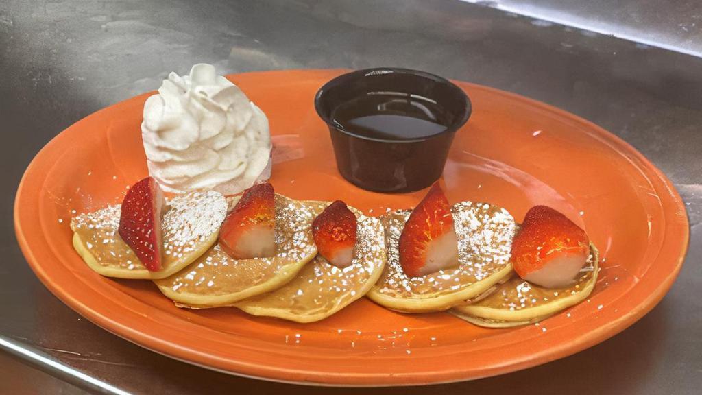 Kids- Silver Dollar Pancakes · Silver Dollar Pancakes- with Strawberries, Powdered Sugar, Whipped Cream, 100% Maple syrup and Fresh Fruit