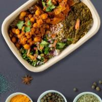 Monster Cluck Bowl · Delicious chicken tikka masala, chana masala (chickpeas), and desi homestyle mix dal with Ba...