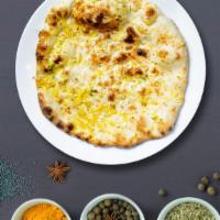 Garlic Naan · Freshly baked bread in a clay oven garnished with garlic and butter. Talk about getting' fre...