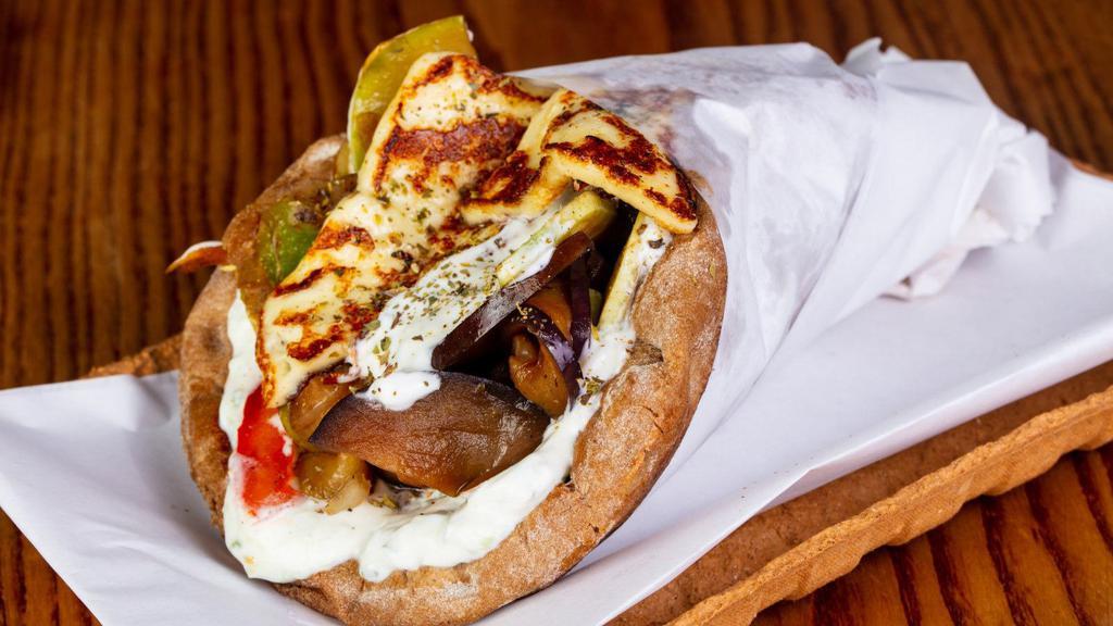 Vegetarian Gyro · Fresh gyro built with, falafel, veggies, and tzatziki sauce on thick pita bread.