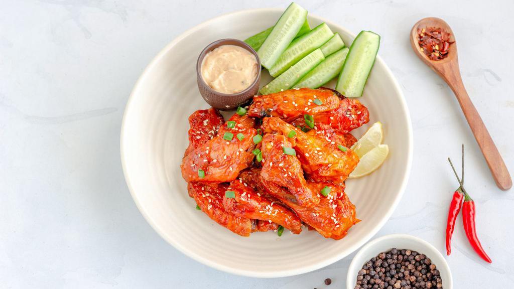 Thai Chili Wings · Crispy, golden fried wings with sweet and spicy Thai chili sauce.