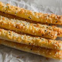 10 Piece Breadsticks with Cheese · Our house breadsticks, made fresh daily, with cheese, baked until golden brown.