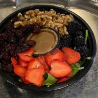 Spinach with Berries Salad · Spinach, fresh berries, walnuts, dried cranberries, all natural vinaigrette dressing on the ...