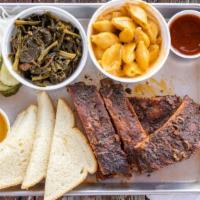BBQ Rib Plate · Fall of the bone delicious slow-smoked ribs, comes whit 2 sides, pickles, onions, 2 slices o...