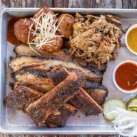4 way BBQ combo plate · All 4 meats, 2 sides, pickles, onions, 4 slices of bread, choice of 4 BBQ sauces: mild musta...