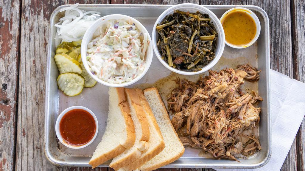 Pulled Pork Plate · Tender delicious melt in your mouth slow smoked pulled pork. Comes whit 2 sides, pickles, onions, 2 slices of white bread. Choice of mild mustard BBQ sauce or Texas red BBQ sauce.