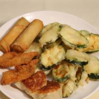 8. Combination Plate 小吃拼盘 · Egg rolls, pot stickers, fried zucchini, and fried prawns two pieces each.