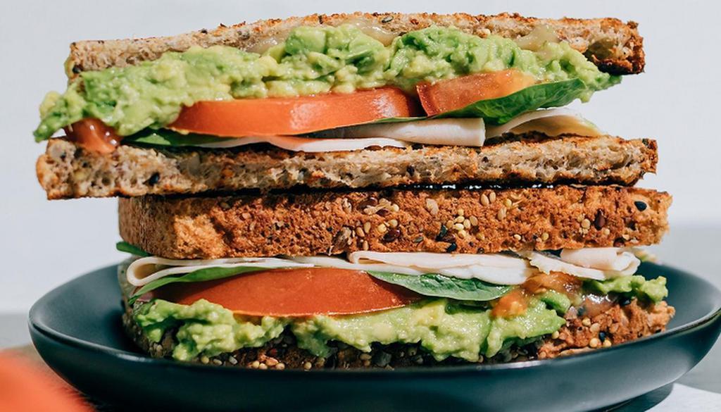 The Cali Sandwich · Toasted Sprouted Bread, Avocado, Provolone Cheese, Chicken, Spinach, Tomato, Garlic & Himalayan Pink Salt Subject to availability. Organic turkey may be substituted for chicken.