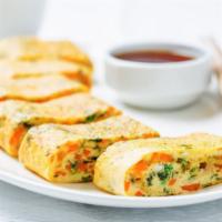 Crispy Egg Rolls · 4 pieces of Golden delicious egg rolls prepared with a house special veggie filling.