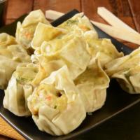 Chicken Dumplings · 12 pieces of Homemade Chicken dumplings prepared in your choice of style.