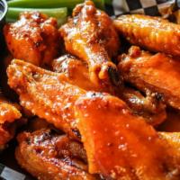 Mild Wings · Wings, marinated in our house seasonings and grilled to a perfect crisp, with a glaze of our...