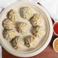 Chicken Momo (10 Psc) · Minced chicken, onions, ginger, cilantro, corn oil. msg and salt rolled in dough steamed int...