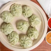 Veg Momos (10 Pcs)  · Paneer, spinach, cabbage, onion, ginger, garlic, cilantro, corn oil, black pepper, MSG, and ...