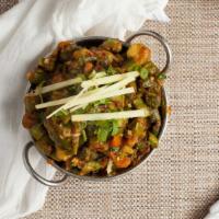 Bhindi Masala (Vegan) · Fresh cut okra cooked with tomato and onion gravy.