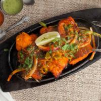 Tandoori Salmon · Fresh salmon chunks marinated in spices and aromatic herbs cooked on skewers.
