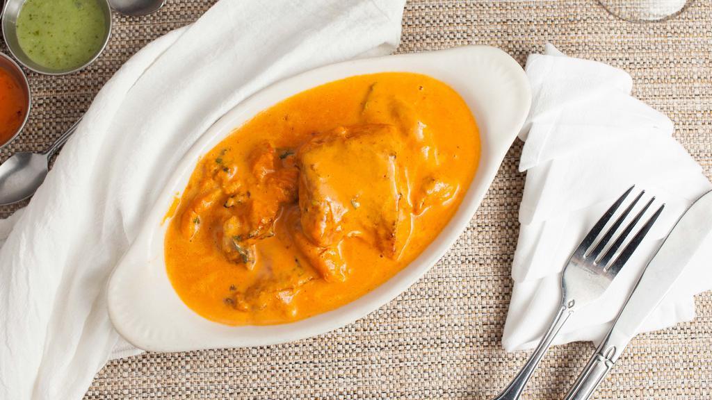 Salmon Tikka Masala · Atlantic salmon cubes roasted in clay oven in a creamy tomato onion sauce with Indian spices.