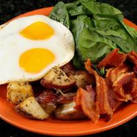 Eggs D'acajou · 2 eggs on a bed of spinach, topped with melted gruyere cheese, bacon and a side of roasted p...