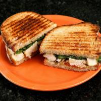Tuscan Chicken Panini · With oven roasted tomatoes, melted fontina cheese, fresh spinach, housemade mayo and basil p...