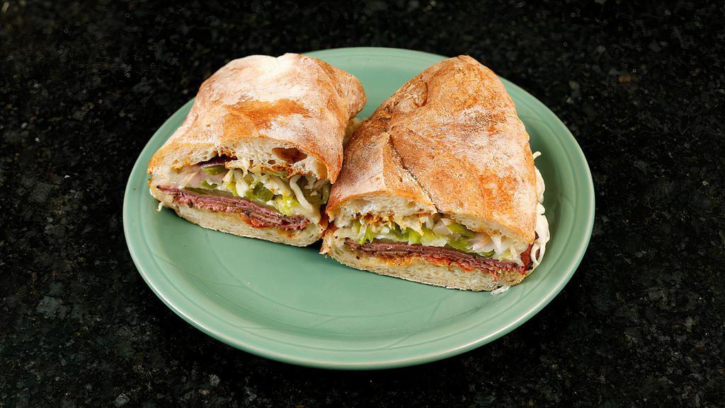 Roberts' Pastrami Sandwich · Longtime San Francisco favorite Roberts' Pastrami with fresh tomato, housemade pickles, jack cheese, spicy cabbage slaw and creole mustard on our rustic white baguette.