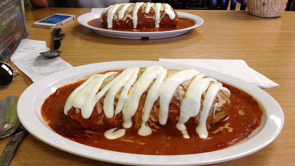 Wet Burrito · Choice of meat, rice, beans, pico de gallo, guacamole, and sour cream. Wet with a homemade sauce and salsa.