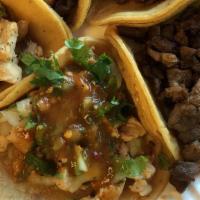 Regular Taco · cilantro, onions, hot sauce, choice of meat