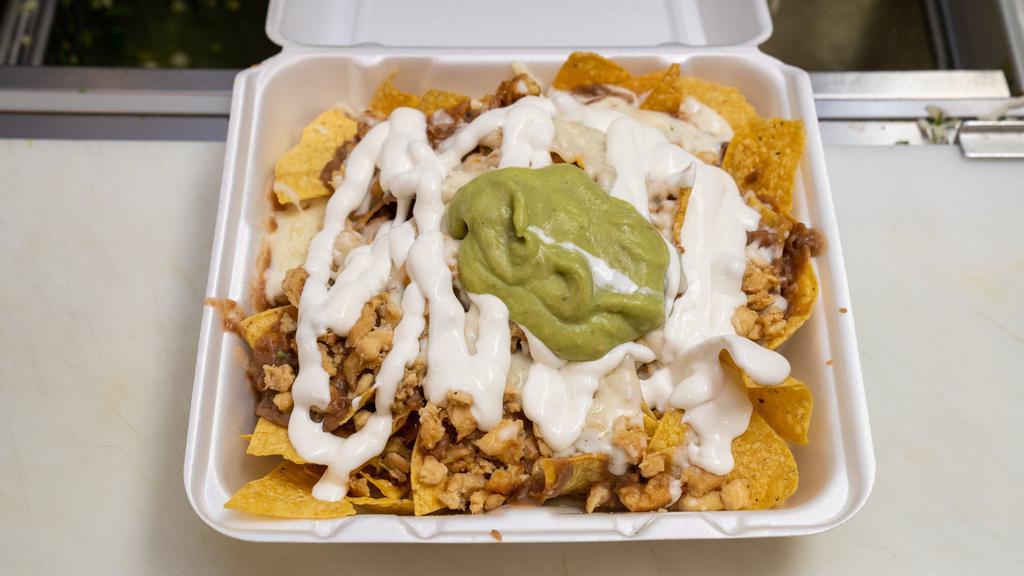 Nachos Plate · With refried beans, cheese, onions, cilantro, guacamole, sour cream and jalapenos