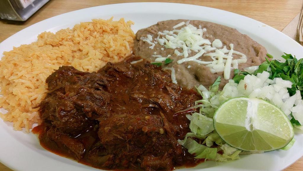 Chile Colorado Plate · Includes rice, beans, pico de gallo, lettuce, guacamole, and corn tortillas.